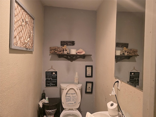 bathroom featuring toilet