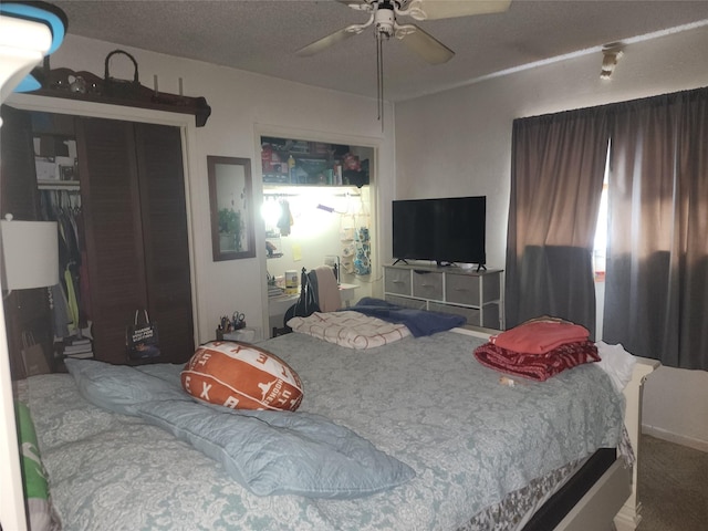 bedroom featuring ceiling fan and a closet