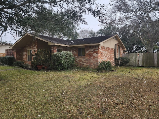 view of home's exterior featuring a yard