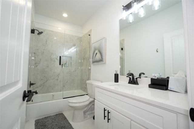 full bathroom with bath / shower combo with glass door, vanity, toilet, and tile patterned flooring