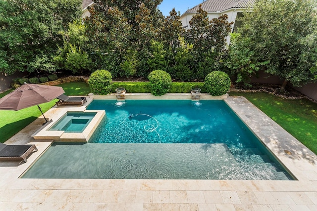 view of pool with a fenced backyard, a pool with connected hot tub, and a patio