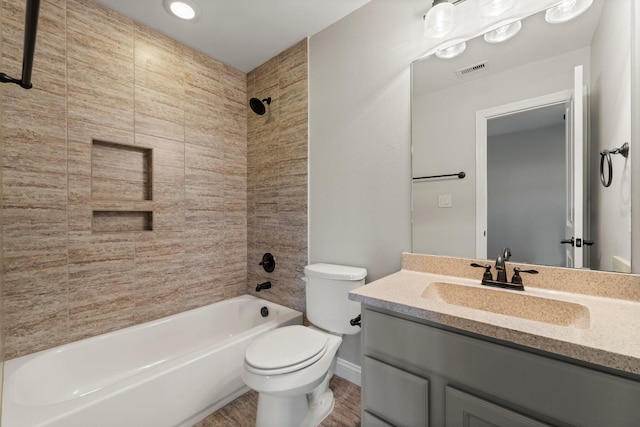 full bathroom with toilet, bathtub / shower combination, visible vents, and vanity