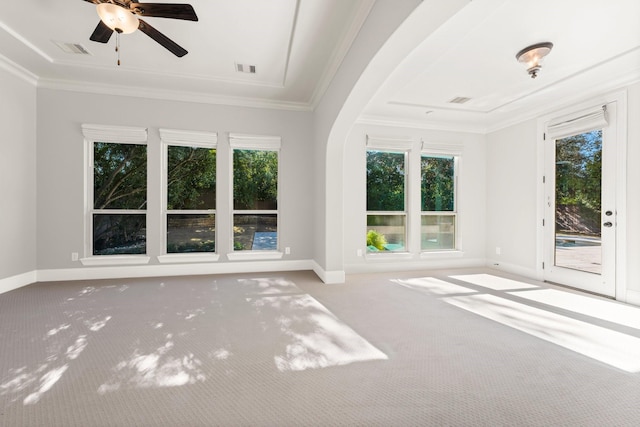 unfurnished living room with ornamental molding, visible vents, carpet floors, and baseboards