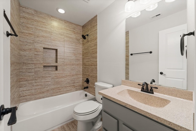 full bathroom with toilet, bathing tub / shower combination, vanity, and visible vents