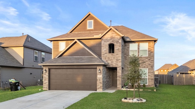 front of property with a garage, central AC unit, and a front lawn