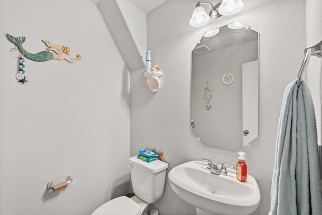 bathroom featuring sink and toilet