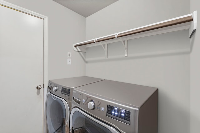 clothes washing area featuring washing machine and dryer