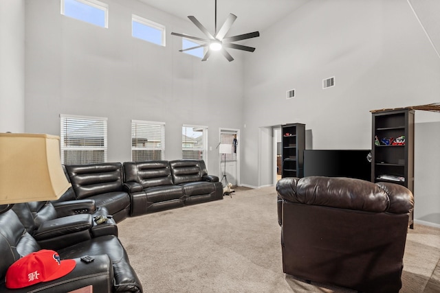 living room featuring ceiling fan, light carpet, and high vaulted ceiling