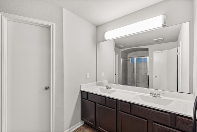 bathroom featuring vanity and a shower