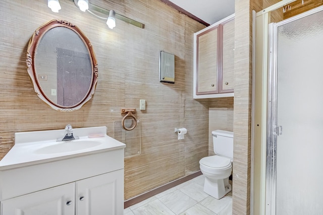 bathroom featuring tile patterned floors, toilet, a shower with door, and vanity