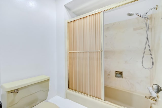 bathroom featuring toilet and bathing tub / shower combination