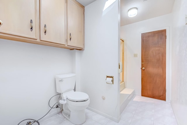 bathroom with tile patterned flooring and toilet