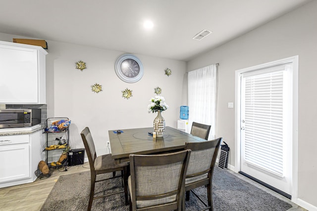 dining area with light wood-type flooring