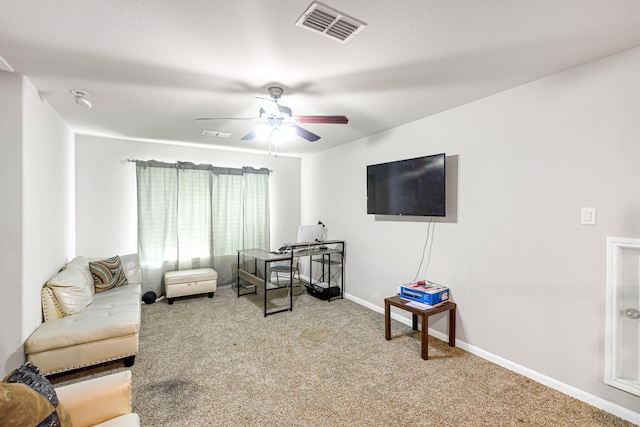 carpeted living room featuring ceiling fan