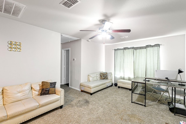 carpeted living room with ceiling fan