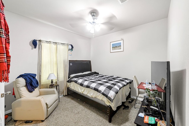 bedroom featuring ceiling fan and light colored carpet