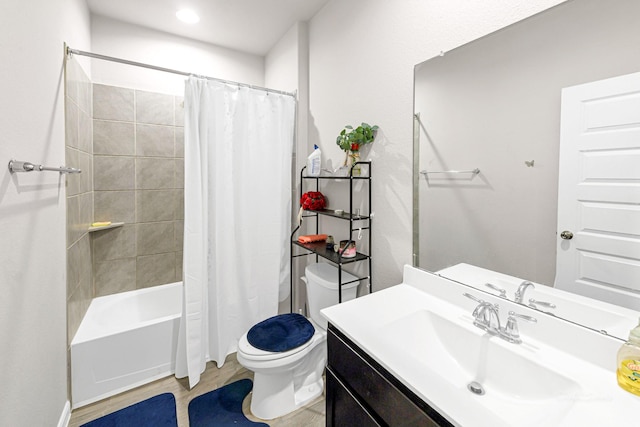 full bathroom featuring vanity, shower / bath combination with curtain, and toilet