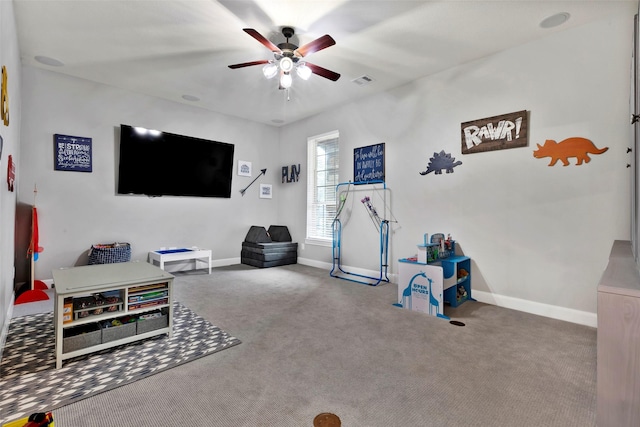 recreation room with carpet floors and ceiling fan