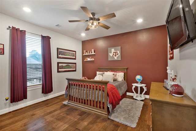 bedroom featuring dark wood-type flooring and ceiling fan