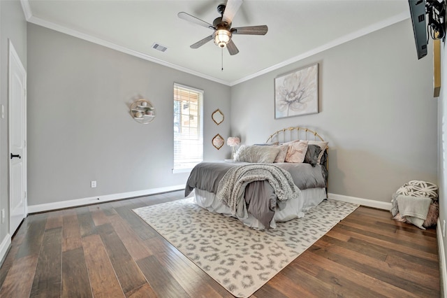 bedroom with ceiling fan, ornamental molding, and dark hardwood / wood-style floors