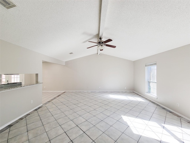 unfurnished living room featuring vaulted ceiling with beams, a textured ceiling, and ceiling fan