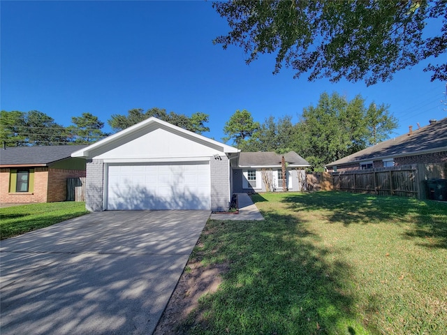 ranch-style home with a garage and a front lawn