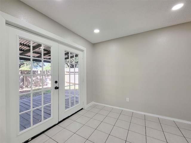 entryway featuring french doors and light tile patterned flooring