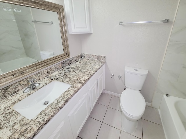 bathroom featuring vanity, tile patterned floors, and toilet