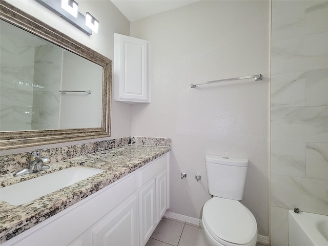 bathroom featuring vanity, tile patterned floors, and toilet