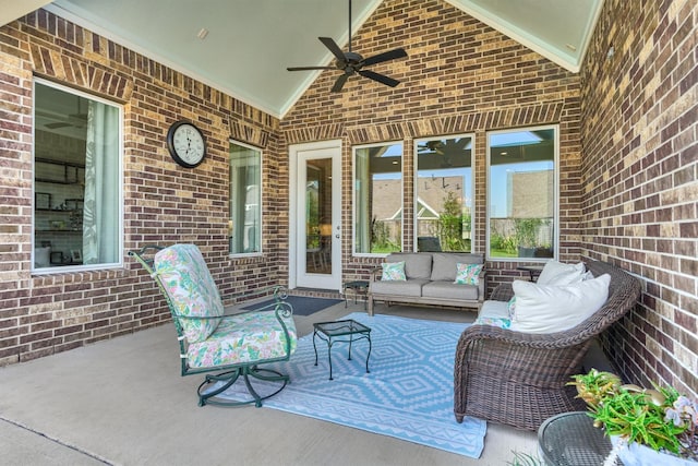 view of patio with an outdoor living space and ceiling fan