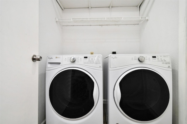 clothes washing area with separate washer and dryer