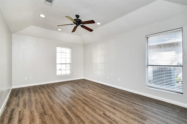 empty room featuring dark wood-type flooring, ceiling fan, and lofted ceiling