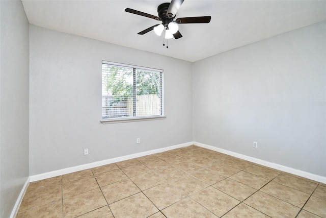 unfurnished room with ceiling fan and light tile patterned floors