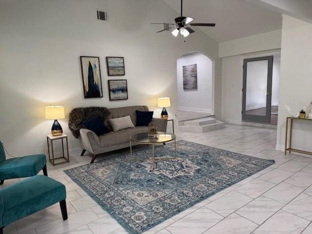2748 Cos St, Liberty, TX 77575 - living room with high vaulted ceiling, a ceiling fan, marble finish floor, visible vents, and arched walkways