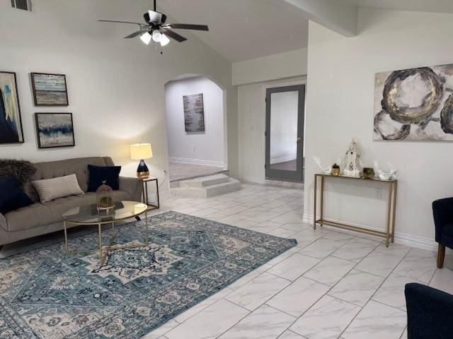 living room with ceiling fan and lofted ceiling