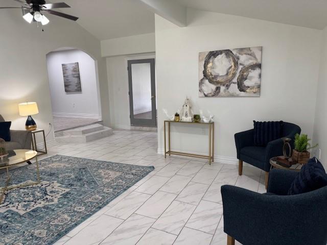 2748 Cos St, Liberty, TX 77575 - sitting room with marble finish floor, vaulted ceiling, arched walkways, and a ceiling fan