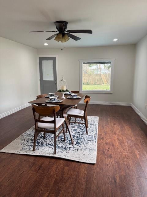 dining area featuring dark hardwood / wood-style floors and ceiling fan