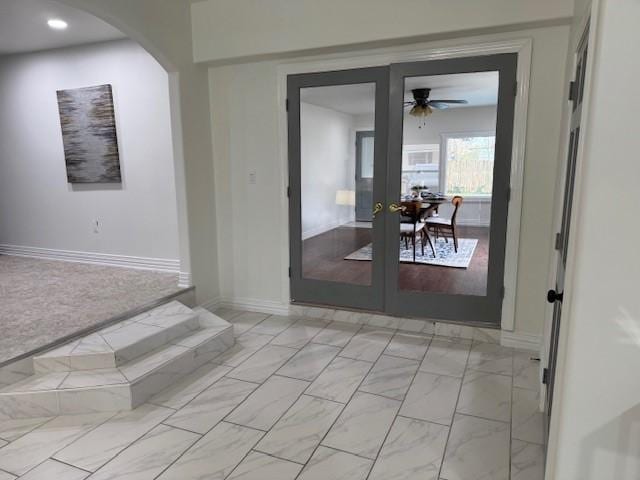 interior space featuring ceiling fan