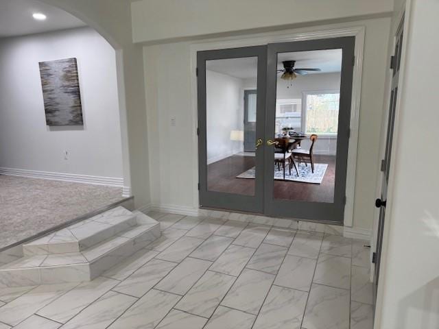 2748 Cos St, Liberty, TX 77575 - interior space with french doors, a ceiling fan, marble finish floor, baseboards, and arched walkways