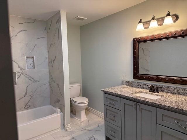 full bathroom with vanity, toilet, and tiled shower / bath combo