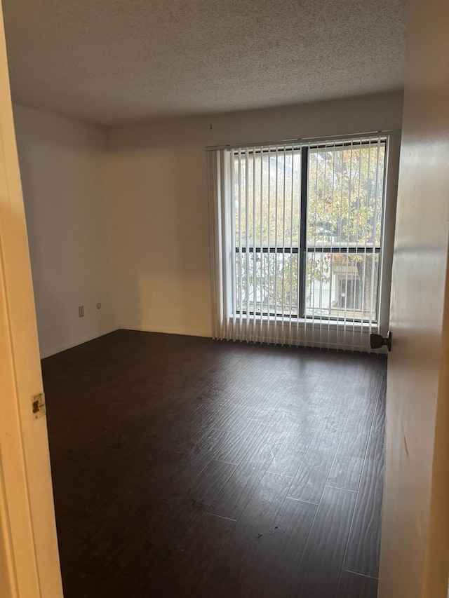 spare room with a textured ceiling