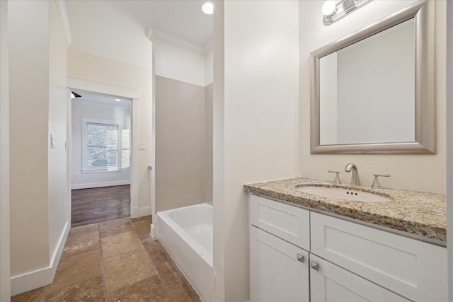 bathroom featuring vanity, ornamental molding, and shower / bathtub combination