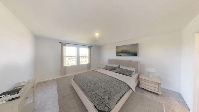 bedroom with light colored carpet