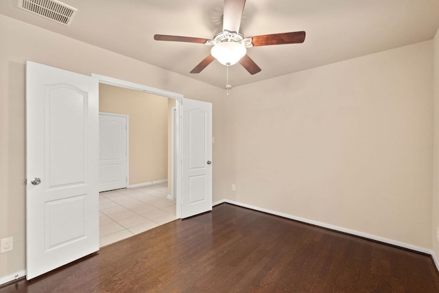 spare room with light hardwood / wood-style floors and ceiling fan