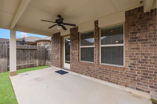 view of patio featuring ceiling fan