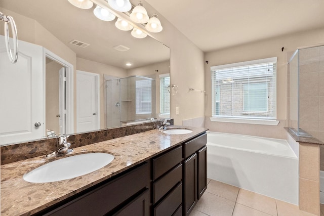 bathroom featuring tile patterned floors, independent shower and bath, and vanity