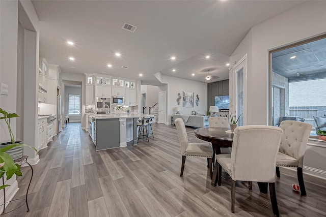 dining space featuring light hardwood / wood-style floors