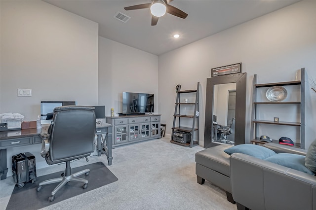 carpeted office with ceiling fan