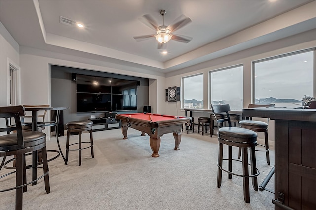 recreation room featuring billiards, light carpet, ceiling fan, and a tray ceiling