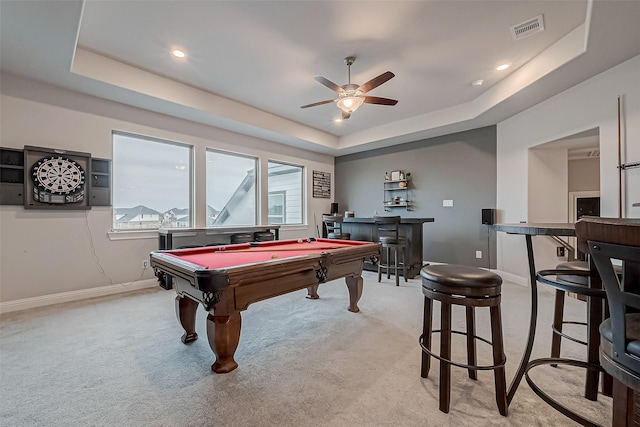 playroom with light carpet, a tray ceiling, and pool table